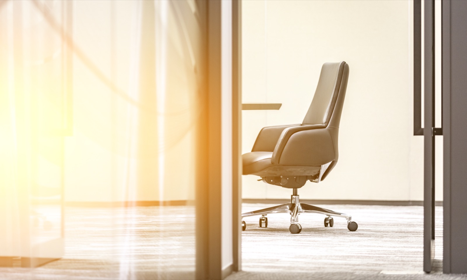 An open glass door in a modern office
