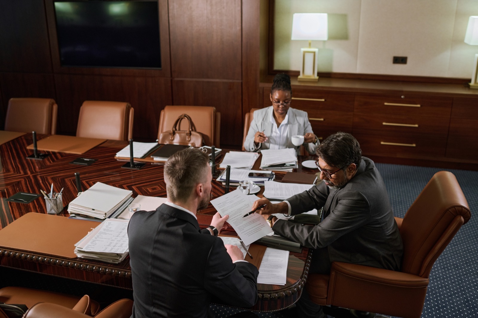 Two colleagues discussing a contract